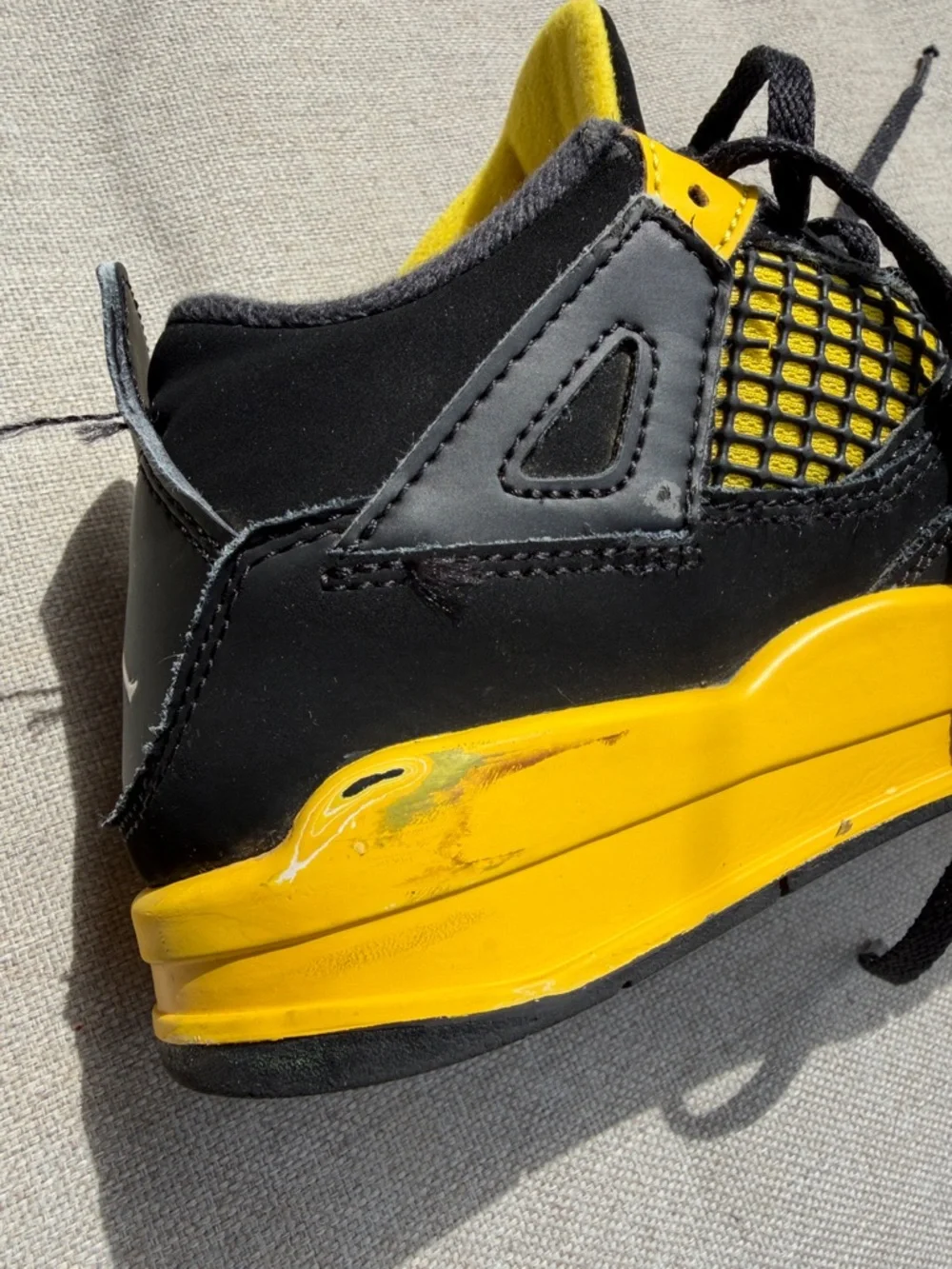 Air Jordan 4 Retro “Thunder” in size 2.5Y GUC.